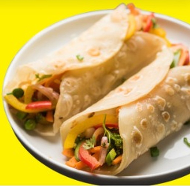 Freshly prepared roti wraps on a plate
